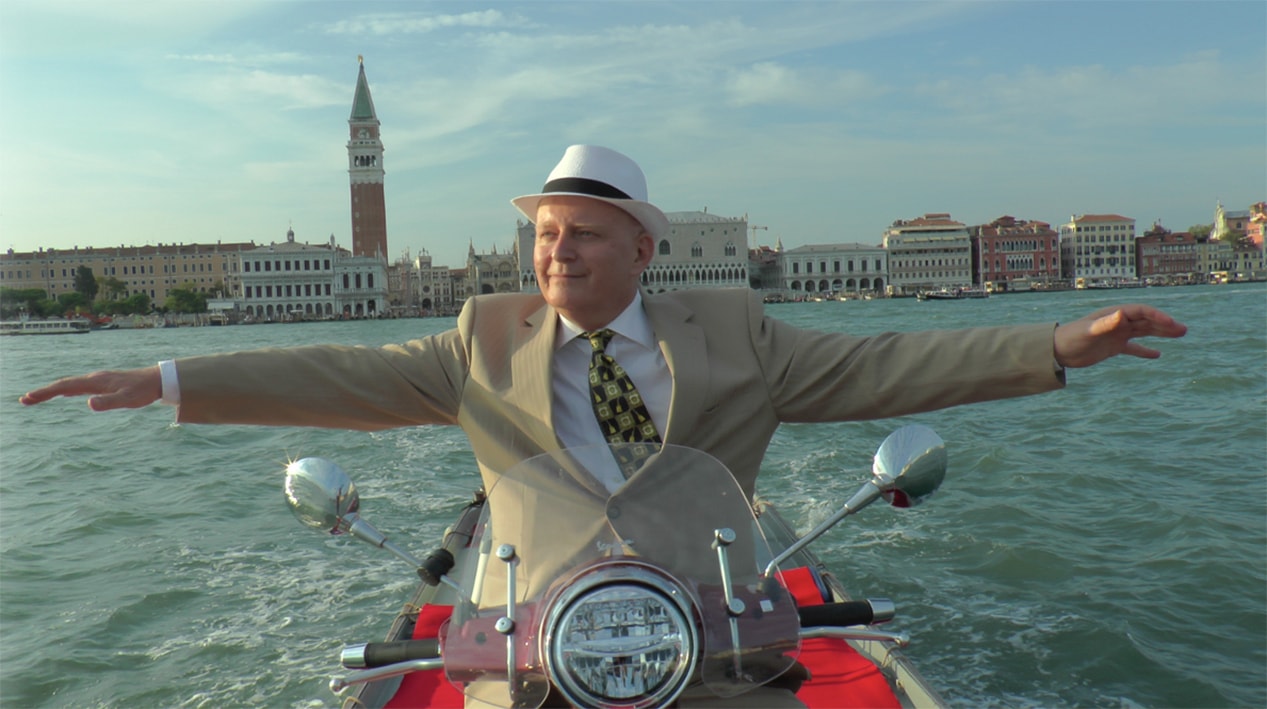 VENICE: Austrian director Hermann Weiskopf and his Vespa in the Venetian Lagoon